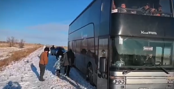 Kazakhstan’s emergency services rescue passengers of a bus heading to Tajikistan